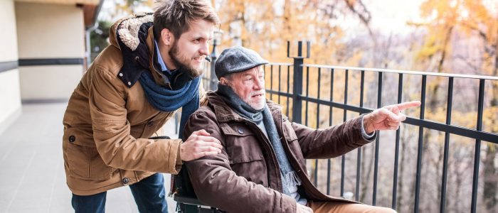 Live-in-Care man assisting elderly man