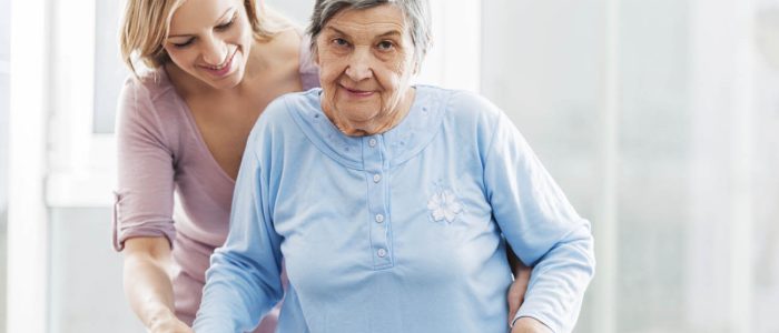 Healthcare worker with a senior patient.